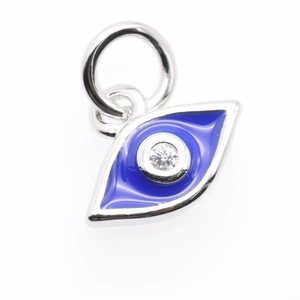 Macro shot of blue enamel Evil Eye pendant with clear zircon and silver plated bail