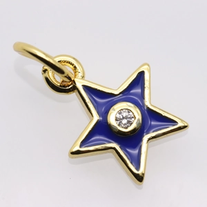 Detailed view of a gold-plated star pendant with blue enamel and a central zircon stone