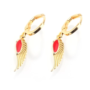 Detailed macro view of golden wing earrings with vibrant red enamel feather accents