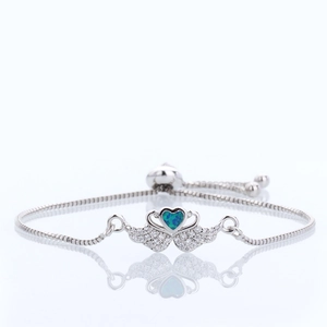 Elegant angel wings and heart opal bracelet with sparkling cubic zirconia on a silver chain