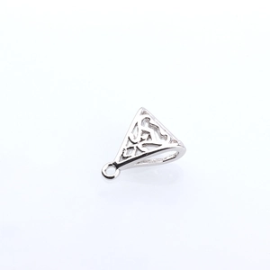 Macro shot of silver-plated hollow triangle charm with intricate filigree pattern
