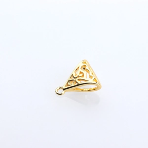 Detailed macro view of a gold-plated triangular openwork pendant with Celtic knot patterns