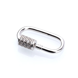 Macro detail of silver oval jewelry carabiner clasp with micro-paved cubic zirconia
