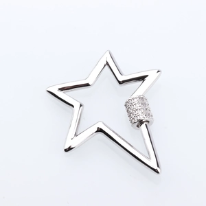 Detail of star shaped jewelry screw clasp with micro-pave cubic zirconia on white background