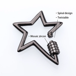 Detail of star-shaped spiral clasp in gun black metal with mosaic zircon inlay