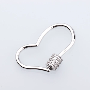 Macro shot of polished heart-shaped screw clasp with pavé cubic zirconia for DIY jewelry