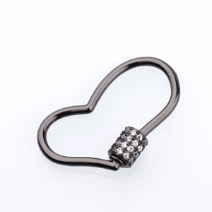 Macro view of gun black heart-shaped screw lock buckle with pavé set white crystals