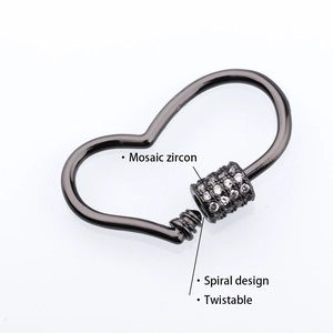 Detail of gunmetal heart-shaped clasp with mosaic zircon pavé and screw lock closure
