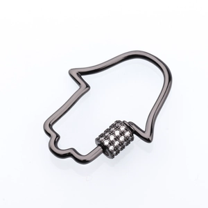 Macro view of gunmetal Hamsa hand clasp with micro-paved crystals for jewelry making