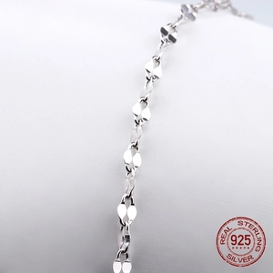 Macro shot of S925 sterling silver chain with heart-shaped interlocking metal links