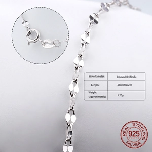 Detailed macro view of an S925 sterling silver chain with 0.4mm links and lobster clasp