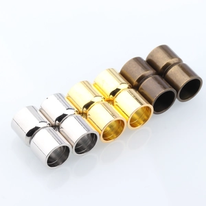 Macro detail of cylindrical magnetic jewelry clasps in gold silver and bronze finish