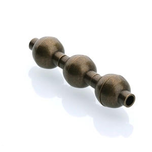 Macro shot of 10x14.5mm bronze magnetic jewelry clasp with vintage triple-ball design