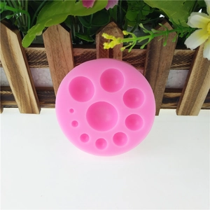 Pink silicone round bead mold with 9 multi-size hemisphere slots for DIY fondant and cakes