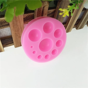 Pink silicone DIY mold with round pearl shapes for cake fondant and handmade crafts
