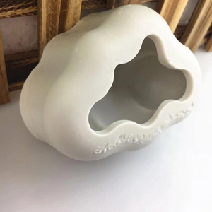 White ceramic cloud-shaped pet nest and desktop decor with embossed lettering design