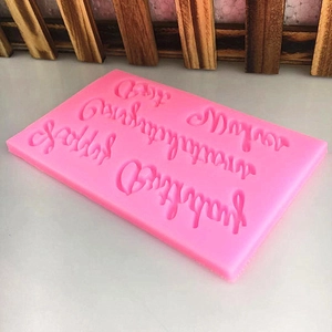 Pink silicone mold with Best Wishes and Happy Birthday text for fondant or chocolate cakes