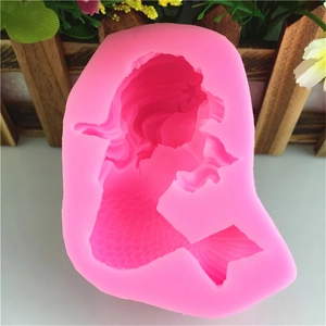 Pink silicone mold featuring detailed mermaid tail design for fondant and candle making