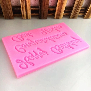 Pink rectangular silicone mold with Best Wishes lettering for fondant and chocolate cake