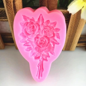 Pink heart-shaped silicone mold featuring three blooming roses for DIY cake decorating