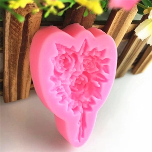 Pink heart-shaped silicone mold featuring a three-rose bouquet for DIY cake decorating