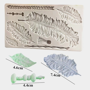 Silicone mold for feather and wheat leaf shapes with finished fondant cake decorations