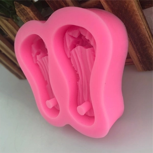 Pink silicone mold featuring dual flip-flop shapes for DIY cake decorating and crafts