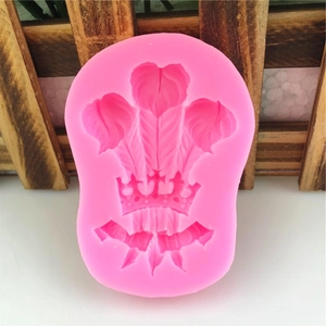 Pink silicone mold featuring feather crown design for DIY cake decorating and crafts