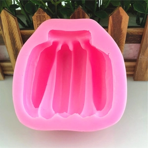 Pink banana-shaped silicone mold for DIY mousse, cake baking, and handmade candles