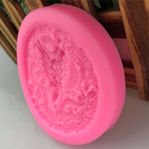 Pink round silicone mold featuring a detailed 3D Chinese dragon relief for cake decorating