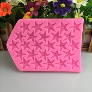Pink silicone mold featuring 26 star-shaped alphabet letters for fondant and chocolate cake decoration