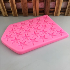 Pink star-shaped silicone mold with 26 letters for cake fondant and chocolate baking