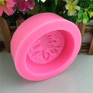 Pink silicone mold featuring traditional Chinese Longevity Shou character and cloud patterns