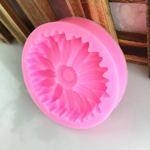 Pink silicone flower mold with detailed sunflower pattern for DIY cake fondant and craft