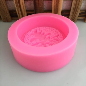 Pink round silicone mold with Shou character relief for DIY soap and fondant making