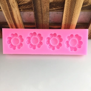 Pink silicone mold with 5-petal flower and heart shapes for DIY chocolate and cake decor