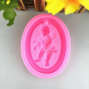 Pink oval silicone mold featuring a detailed embossed angel for DIY plaster and candles
