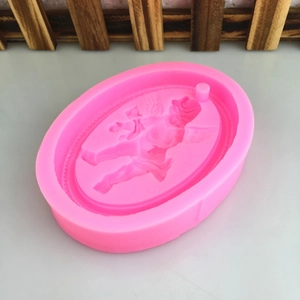 Pink silicone mold featuring an embossed angel design for DIY aromatherapy and candles