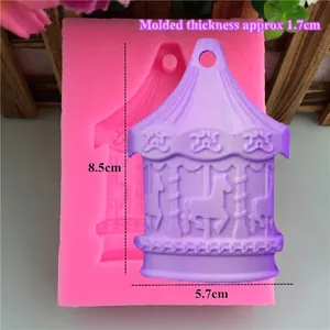 Pink carousel silicone mold with finished purple plaster cast showing size measurements