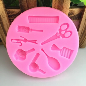 Pink silicone hair styling tool mold featuring comb, scissors and hair dryer for cake DIY