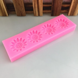 Pink silicone mold featuring four sunflower cavities for DIY fondant and cake decoration