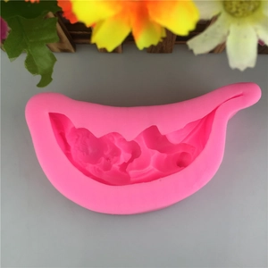 Detailed close-up of a pink silicone baby sleeping on lotus leaf DIY fondant cake mold