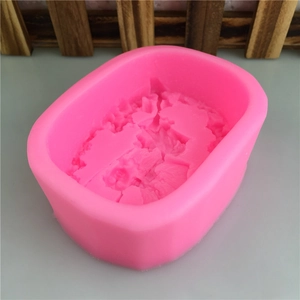 Pink silicone mold featuring intricate rock texture for DIY plaster and candle crafts