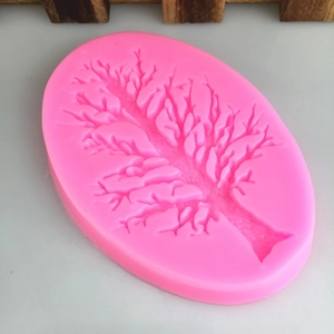 Pink silicone mold featuring detailed tree branch designs for DIY cake decorating and crafts