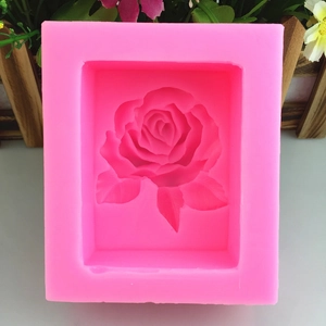 Pink silicone rose flower mold with intricate petal details for DIY handmade cake soap
