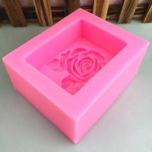 Pink silicone mold with detailed rose flower design for handmade soap and cake baking
