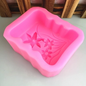 Pink silicone mold with narcissus flower patterns for DIY candles and soaps
