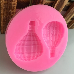Pink round silicone mold featuring dual hot air balloon shapes for DIY fondant or cake