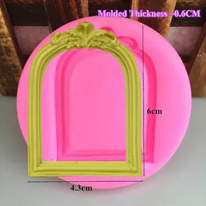 Pink silicone vintage floral frame mold with a yellow fondant baroque arch display