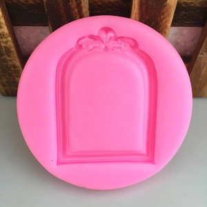 Pink silicone round mold featuring vintage European floral arch frame for fondant